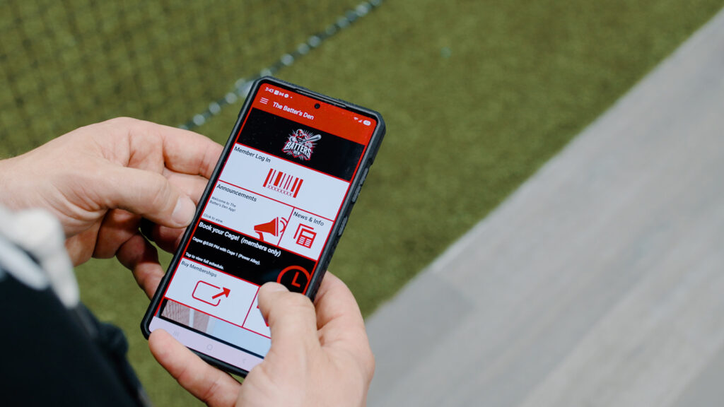 The Batter's Den App displayed on a mobile phone.